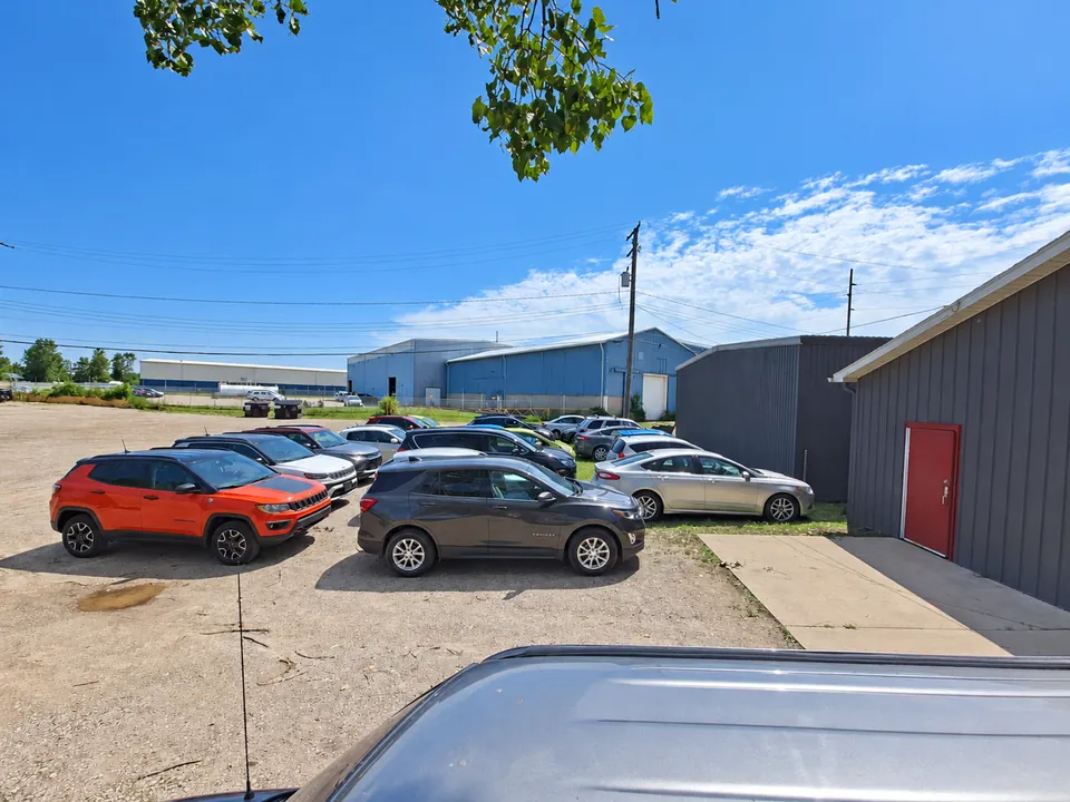 A lineup of vehicles in a rental-car lot.